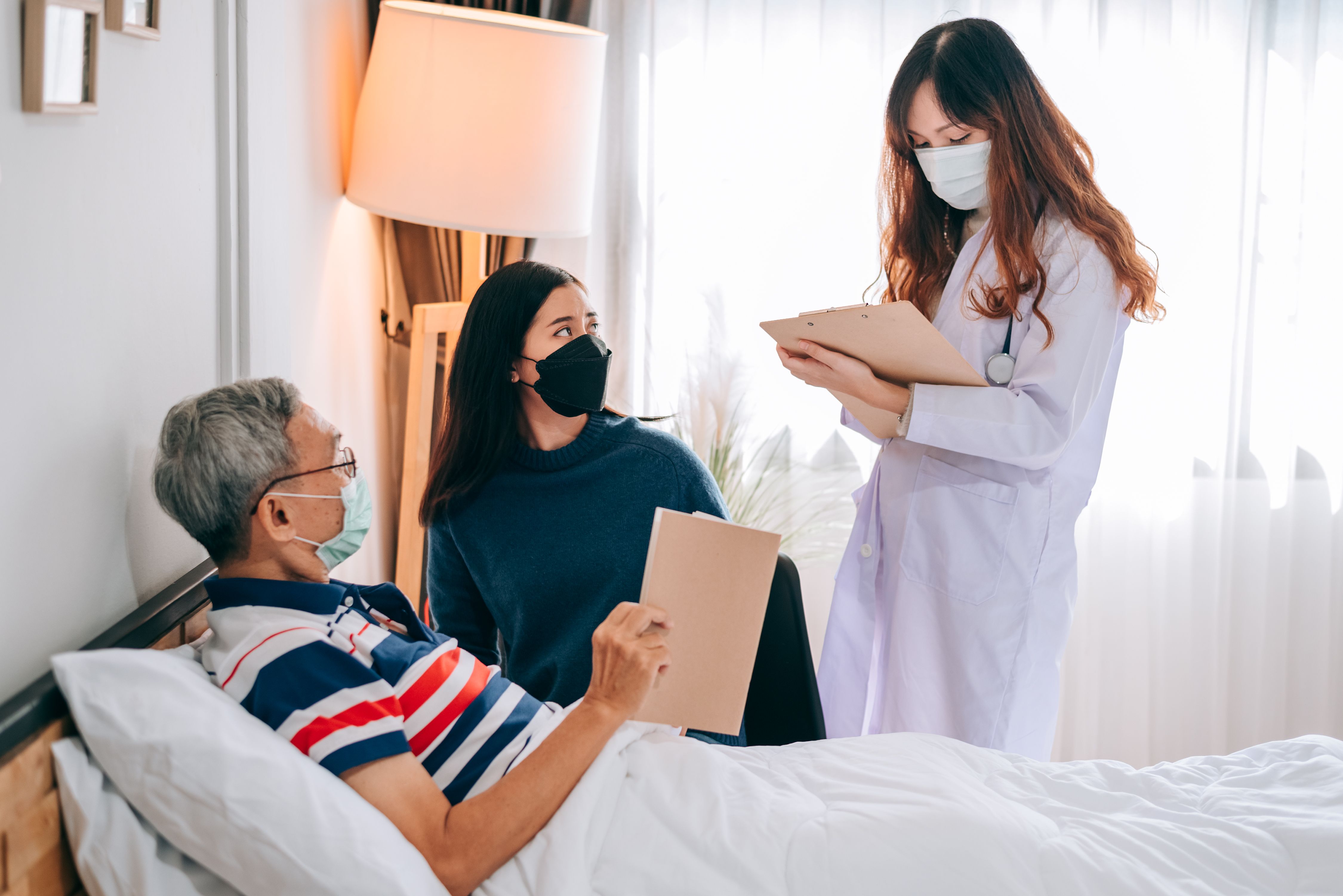 asian-doctor-visit-examines-senior-man-home-doctor-checking-up-consulting-retirement-health-partienthospital-services-wearing-mask-protect-covid19.jpg
